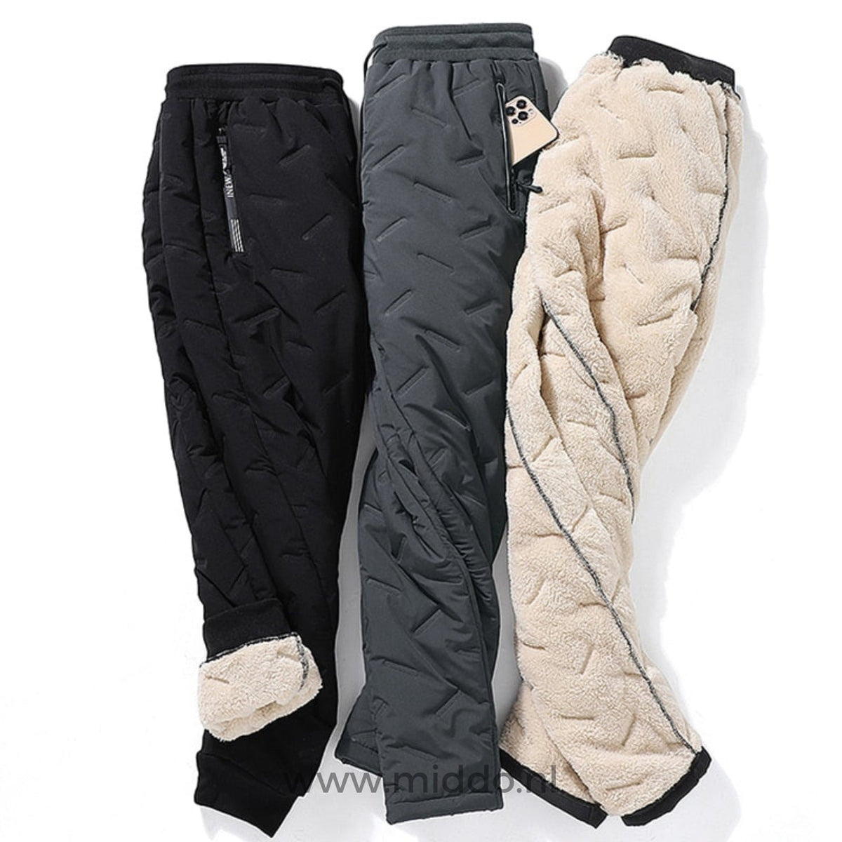 Drei WarmGuard Thermo Unisex-Hosen in verschiedenen Farben und mit einer ausgestellten Fütterung