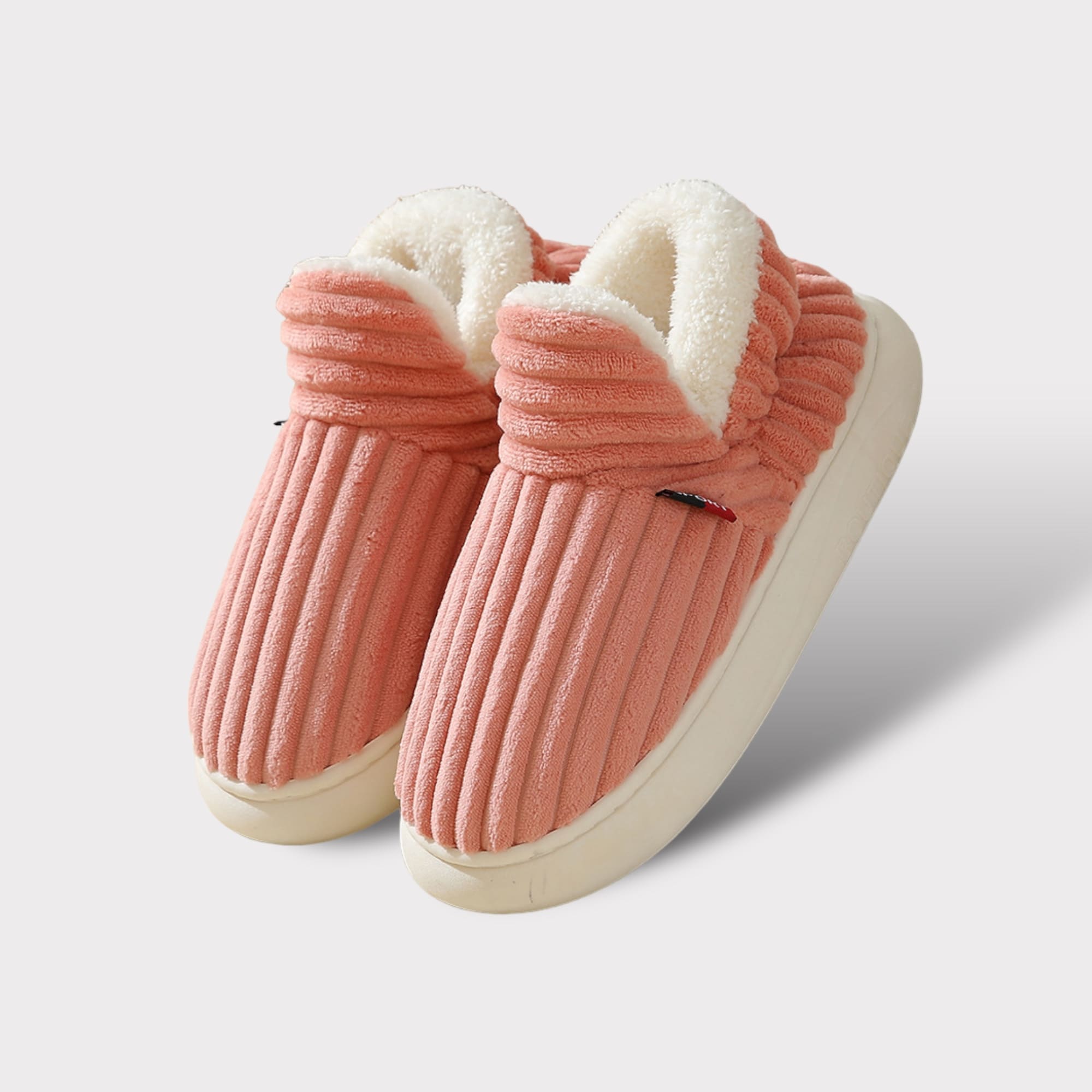 Rosa Komfort-Fleece-Pantoffeln mit weißer Fleece-Fütterung und weißer Gummisohle.