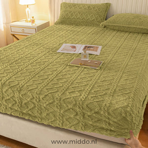 Fleece-Spannbettlaken in Grasgrün.