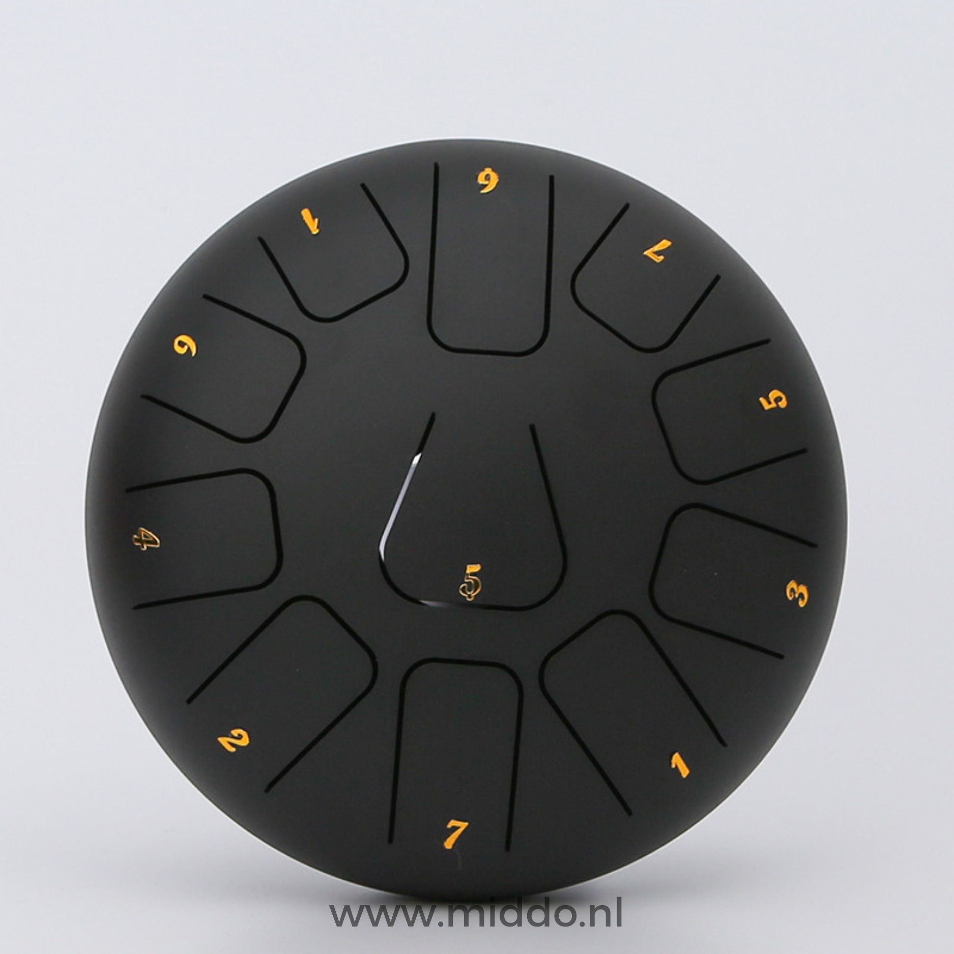 Schwarze Stahl-Zungeninstrument mit 20 cm Durchmesser und Zahlen auf einem weißen Hintergrund.