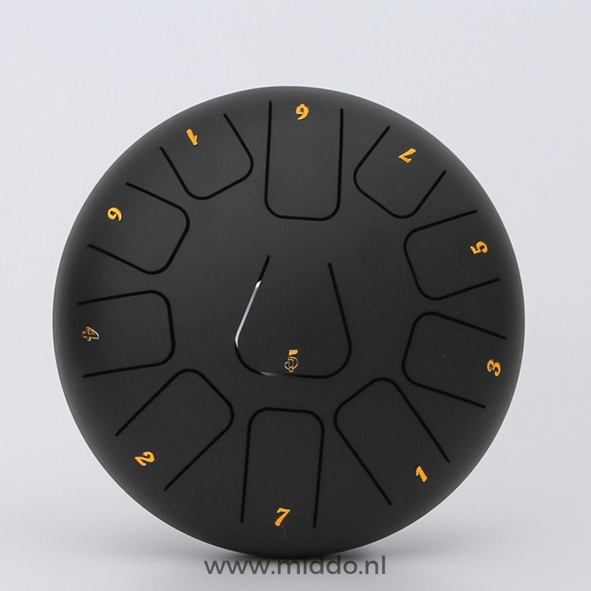 Schwarze Stahl-Zungeninstrument mit 20 cm Durchmesser und Zahlen auf einem weißen Hintergrund