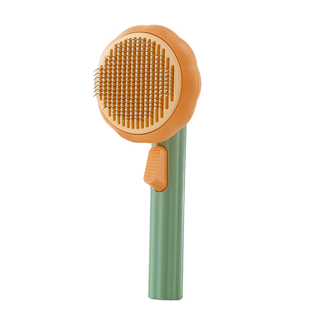 Selbstreinigende Bürste für Haustiere in Grün und Orange.