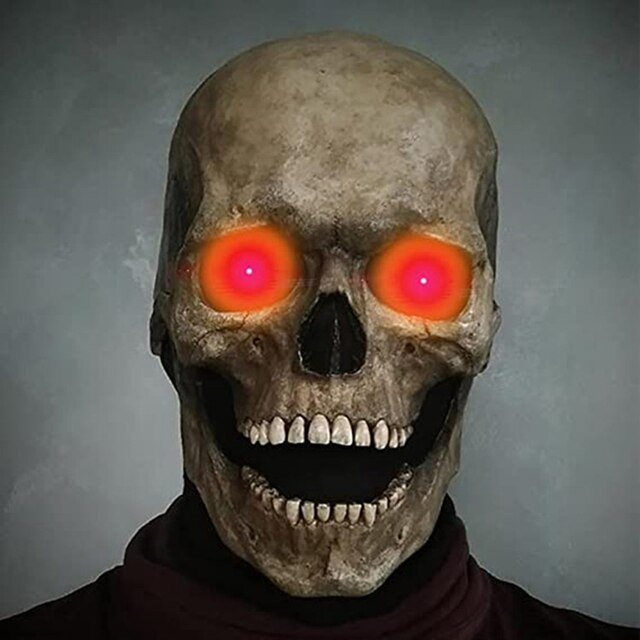 Schädelmaske mit leuchtend roten Augen und grinsendem Mund