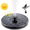 Detail einer schwarzen Fontäne mit Sonnensymbol und Kolibri