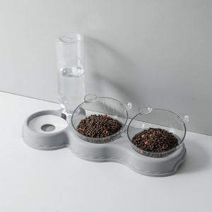Graue Futterschale mit Wasserspender und Futterbehältern