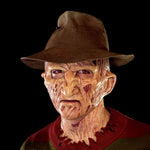 Zombiora Maske – Verbrennungsmaske mit Hut und roten Augen - www.middo.de