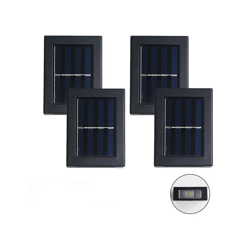 Vier Solarpanelaußenlampen in einer Reihe auf einem weißen Hintergrund.