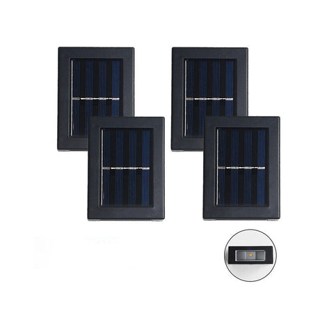 Vier Solarpanelaußenlampen in einer Reihe auf einem weißen Hintergrund