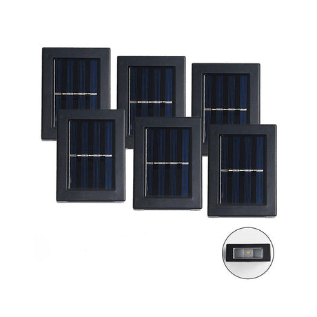 Sechs Solarpanel Außenlampen in einer Reihe auf einem weißen Hintergrund