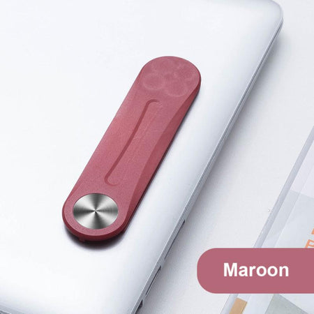 Roter magnetischer Clip, der an einem Laptop befestigt ist, für zusätzlichen Komfort.