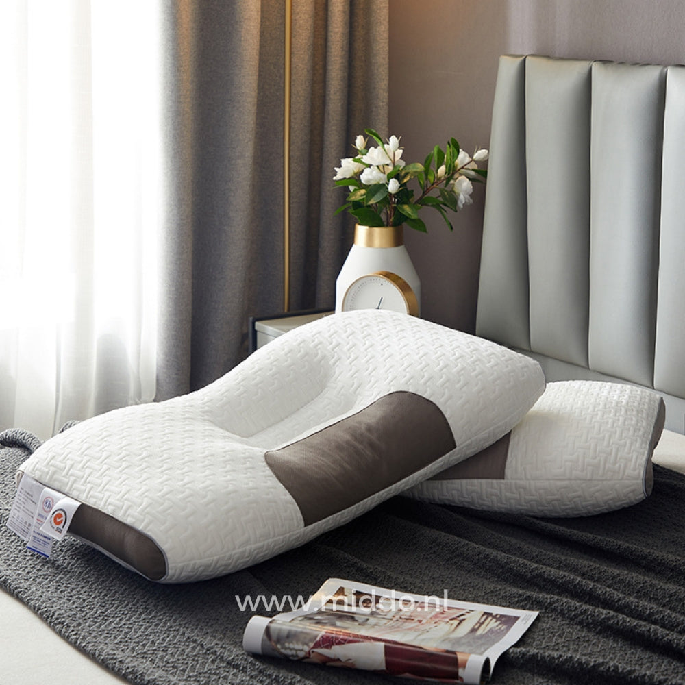 DreamGuard Pro Nackenstützkissen auf einem Bett.